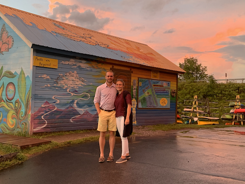 Ryan and Clara in front of the Harvest and Hearth Restaurant.